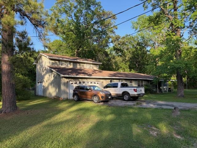 235 Connell Road Vidor, TX 77662 - Photo 3 of 35 a front view of a house with garden