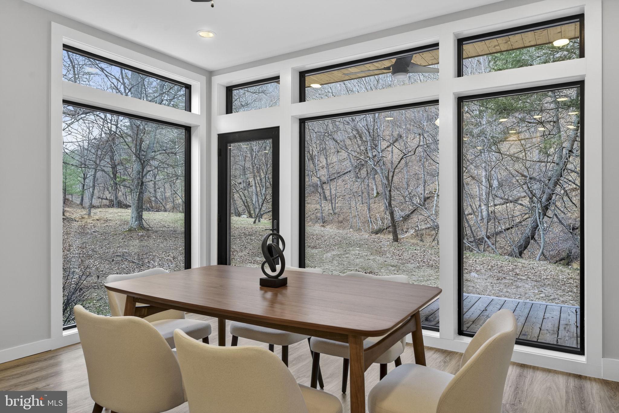 1956 Dove Hollow Road Mathias, WV 26812 - Photo 20 of 113 a view of a dining room with furniture window and wooden floor