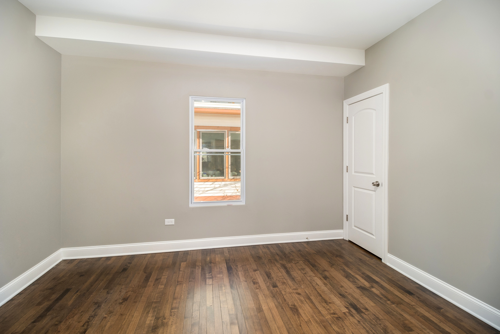 148 East Burlington Street Riverside, IL 60546 - Photo 6 of 16 an empty room with wooden floor and windows