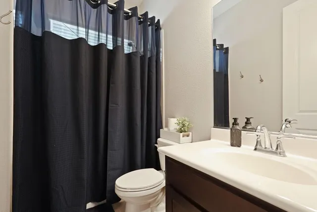a bathroom with a sink double vanity and a mirror