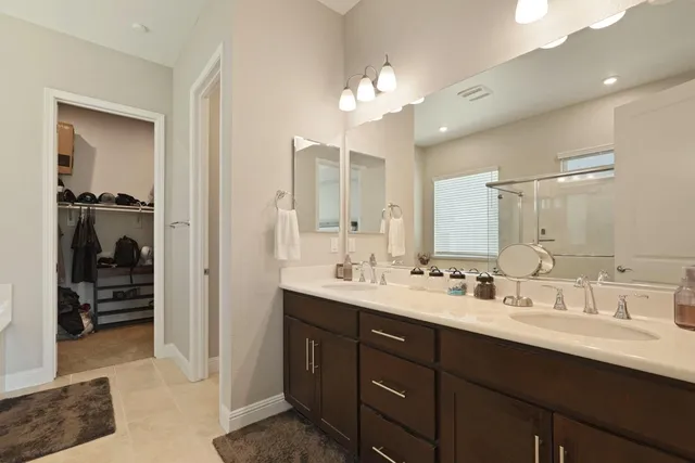 a view of a house with wooden fence