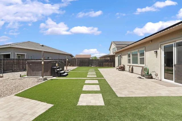 a view of walk in closet with clothes