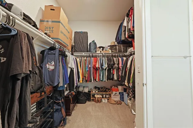 a bedroom with a bed and hallway