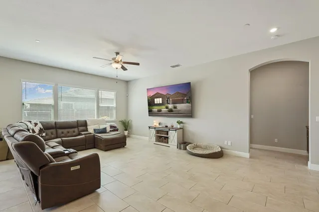a large kitchen with kitchen island a stove a table and chairs in it