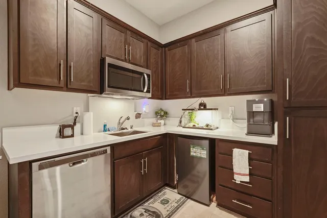 a view of a house with backyard porch and sitting area
