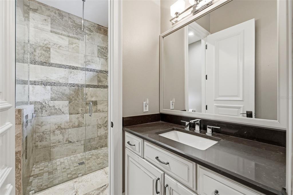 855 Southeast 87th Street Ocala, FL 34480 - Photo 45 of 79 a bathroom with a sink and a mirror