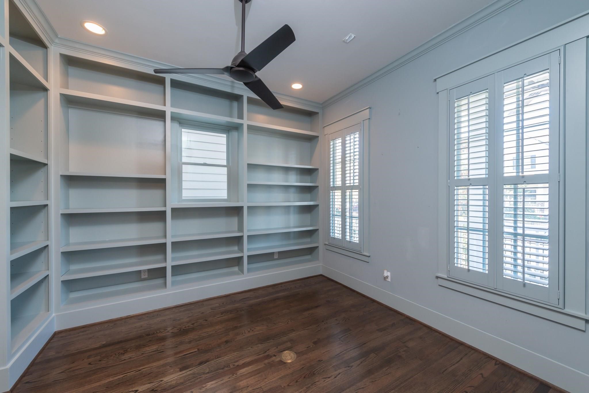 734 Allston Street, Unit B Houston, TX 77007 - Photo 3 of 28 The study overlooks the front of the house. Ample bookshelves and natural light offer a great area for a home office.