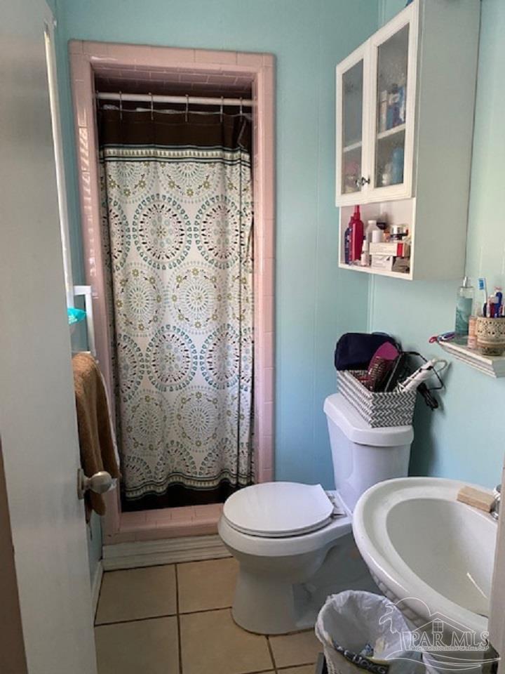 4737 Dean Drive Pace, FL 32571 - Photo 12 of 13 a bathroom with a toilet sink and shower