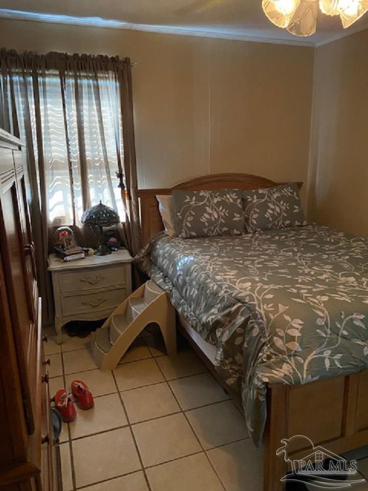 4737 Dean Drive Pace, FL 32571 - Photo 13 of 13 a bedroom with a bed and a window