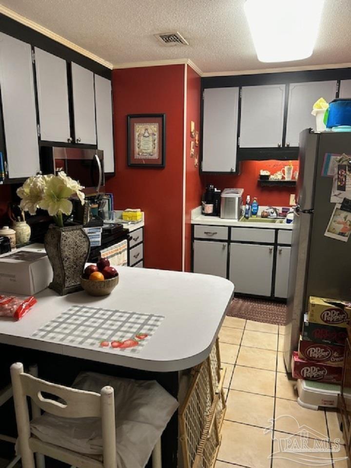 4737 Dean Drive Pace, FL 32571 - Photo 3 of 13 a kitchen with a stove and a refrigerator
