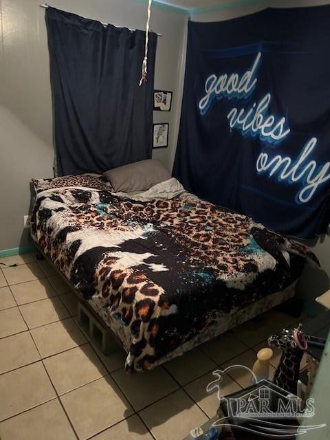 4737 Dean Drive Pace, FL 32571 - Photo 5 of 13 a bed sitting in a bedroom next to a cabinet