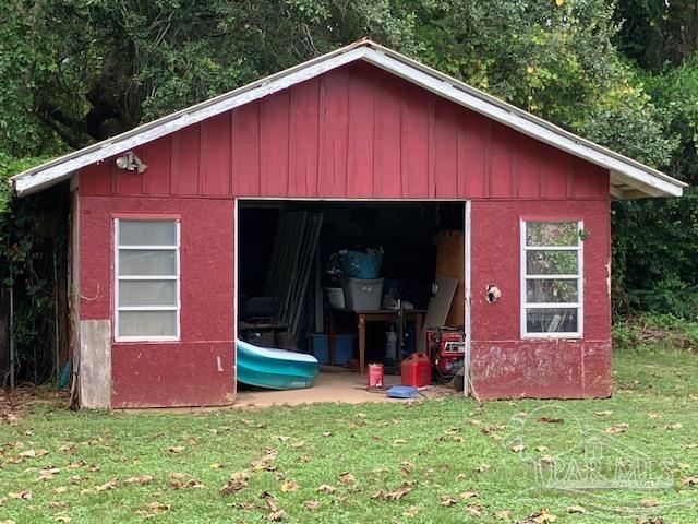 4737 Dean Drive Pace, FL 32571 - Photo 7 of 13 a view of a house with a backyard and porch