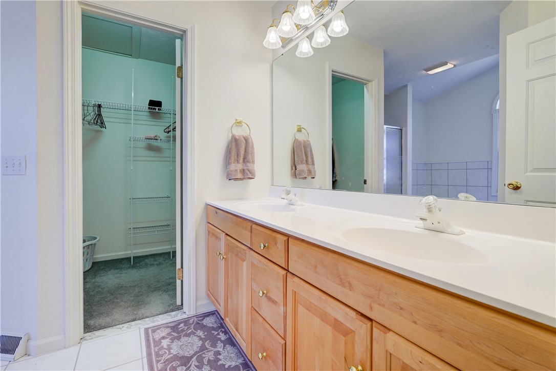 65 Cloverdale Street Rochester, NY 14612 - Photo 23 of 50 oversized double vanity, mirrored wall and walk-in