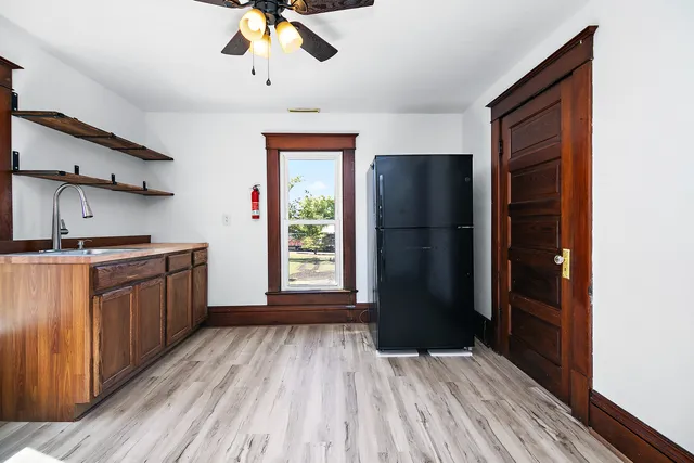 a kitchen with stainless steel appliances granite countertop a refrigerator and a sink