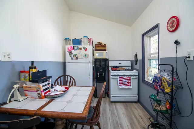 a view of a play room with furniture and toys