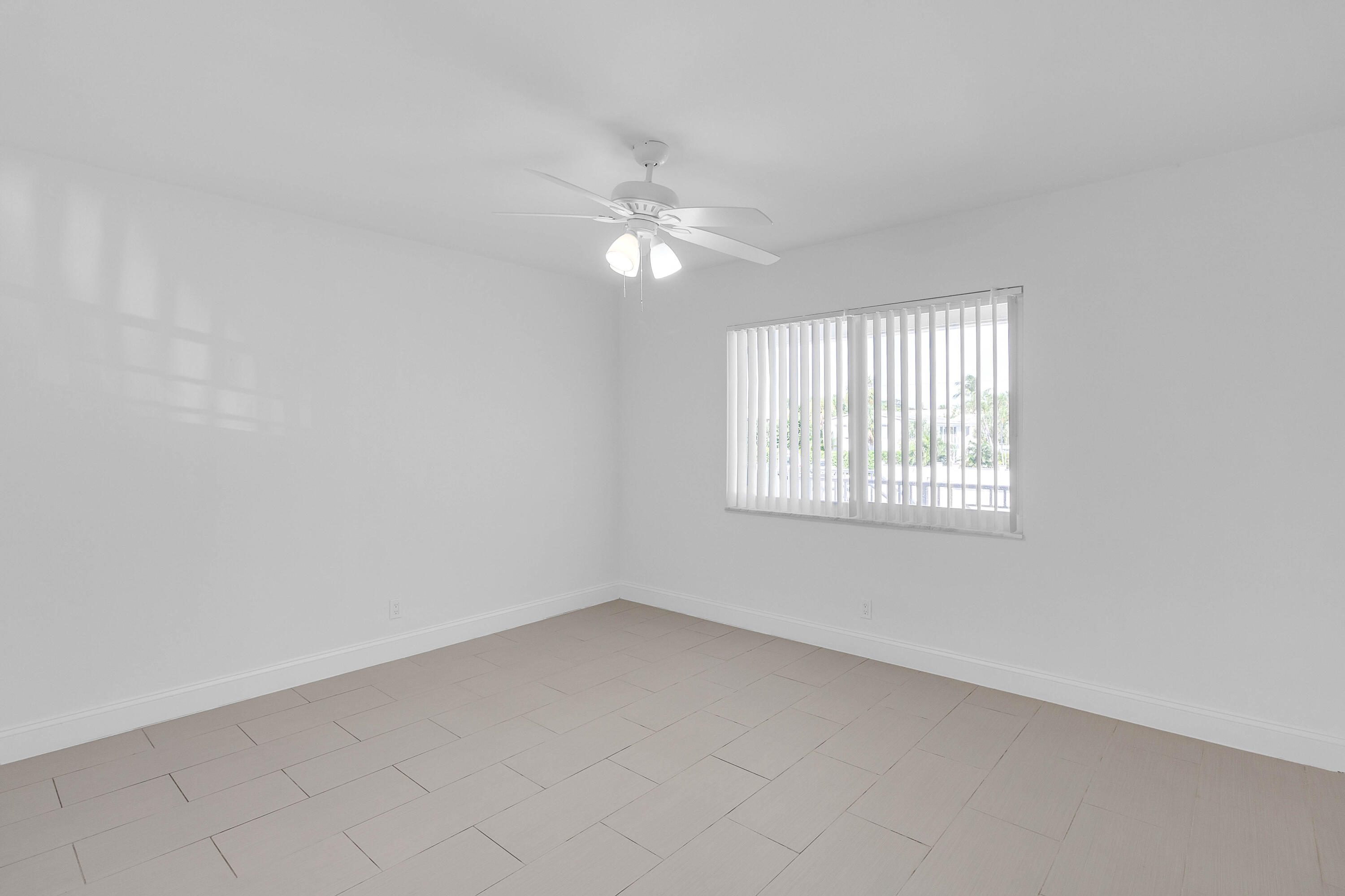 330 West Camino Real Boca Raton, FL 33432 - Photo 13 of 18 an empty room with a window and a fan