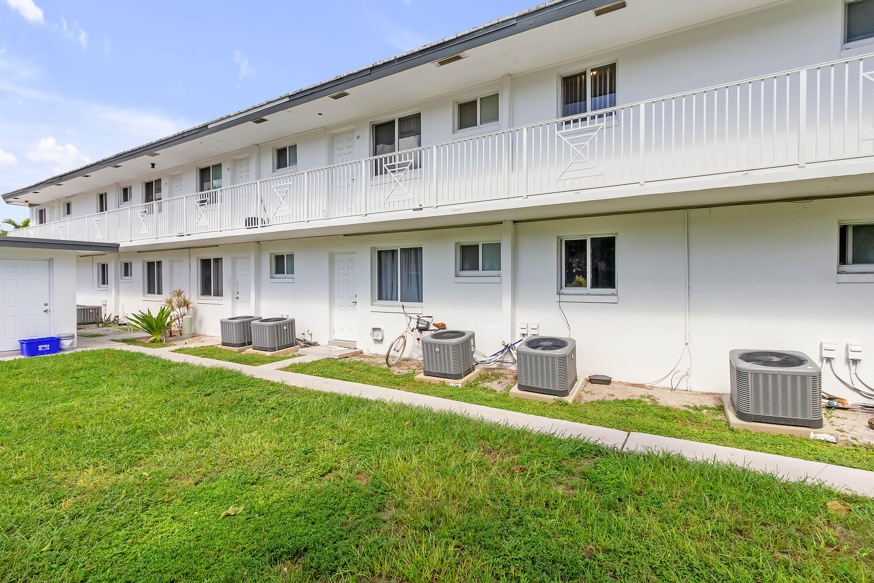 330 West Camino Real Boca Raton, FL 33432 - Photo 17 of 18 a front view of a house with garden and porch