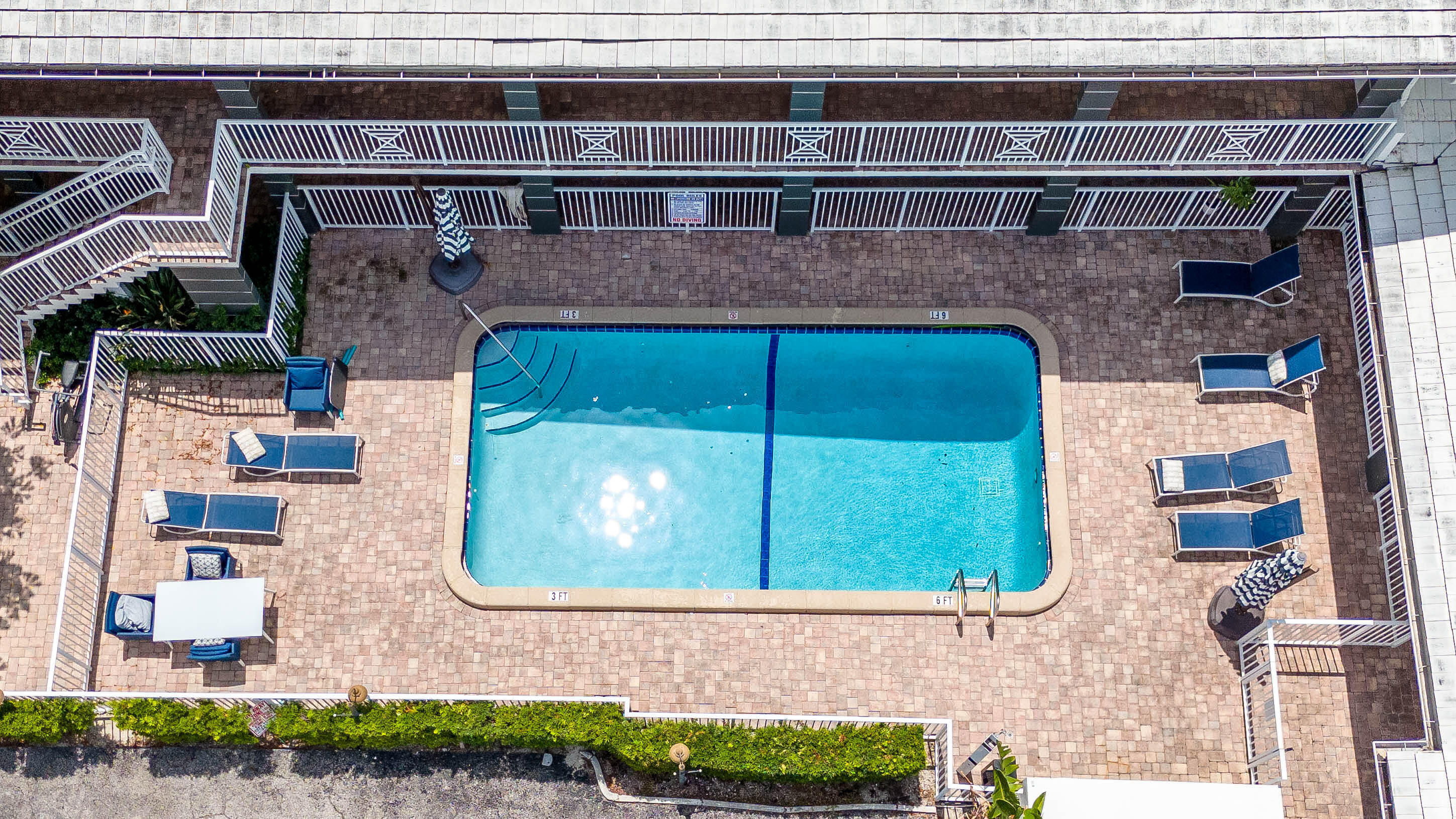 330 West Camino Real Boca Raton, FL 33432 - Photo 3 of 18 a front view of a house with a yard and garage