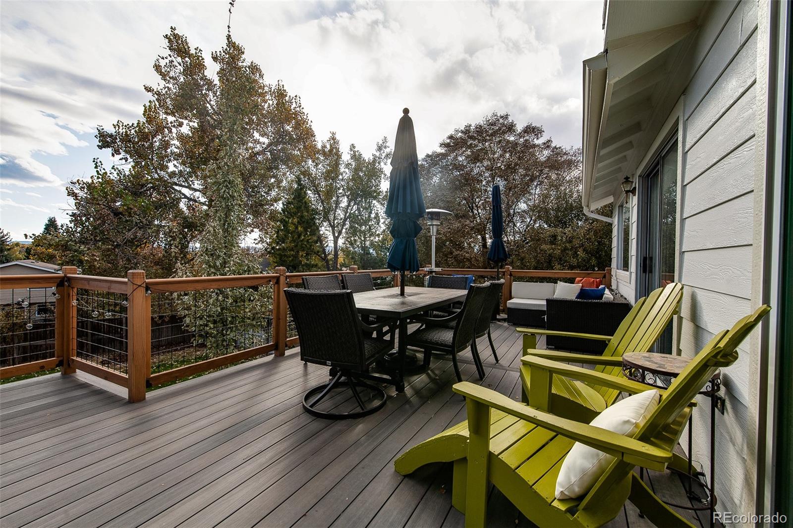 462 Mountain Chickadee Road Highlands Ranch, CO 80126 - Photo 28 of 37 a view of a chairs and tables on the roof