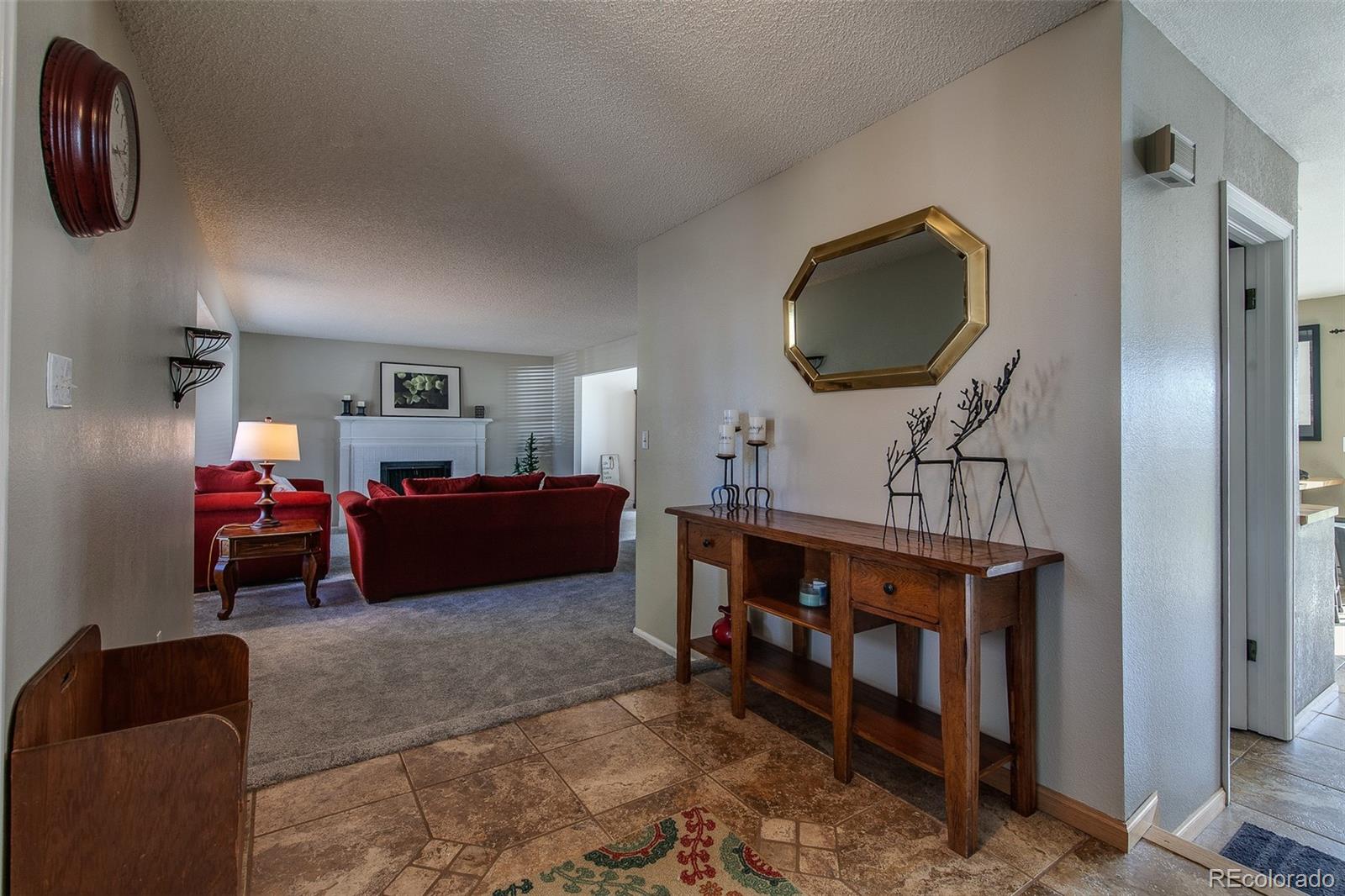 462 Mountain Chickadee Road Highlands Ranch, CO 80126 - Photo 4 of 37 a living room with furniture
