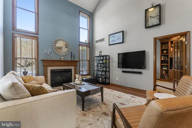 a view of living room with furniture and fireplace