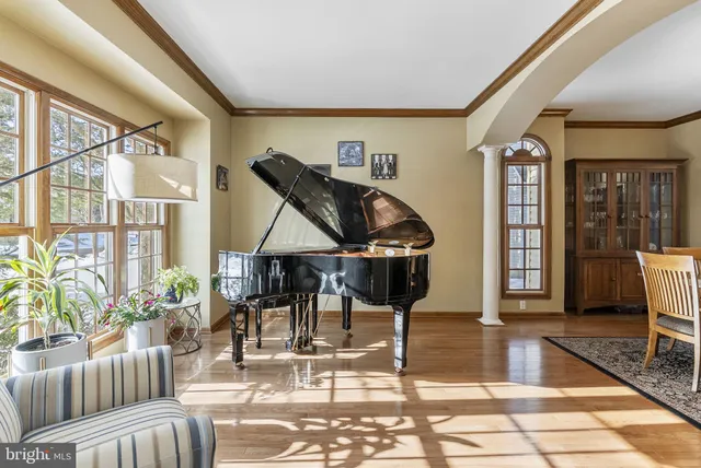 a view of staircase with open kitchen view