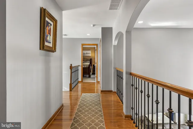 a living room with furniture pool table and a couch