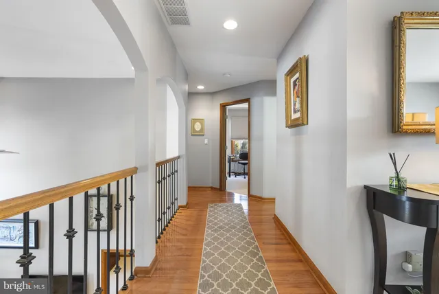 a room with pool table and windows