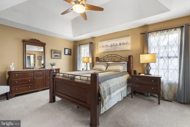 a view of a livingroom with furniture and a flat screen tv