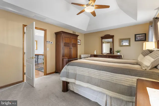 a view of a workspace with furniture and a flat screen tv