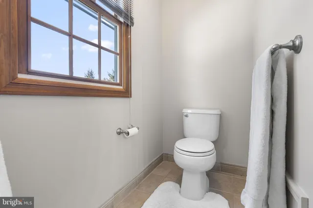 a view of a swimming pool with an outdoor space and seating area