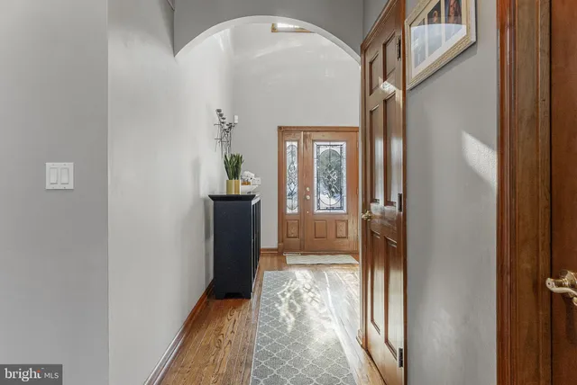 a living room with furniture wooden floor and a table