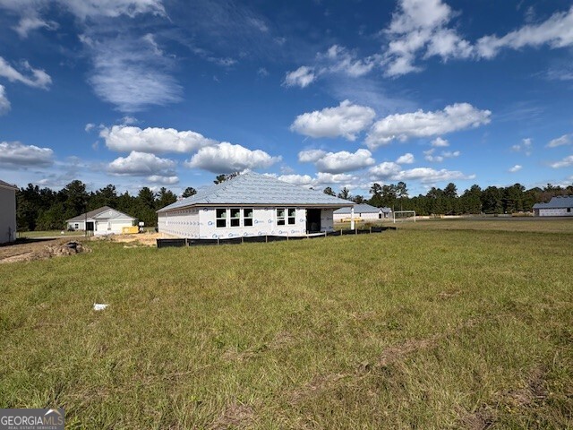 231 Park View Lane Kingsland, GA 31548 - Photo 10 of 22 a front view of a house with a garden and lake