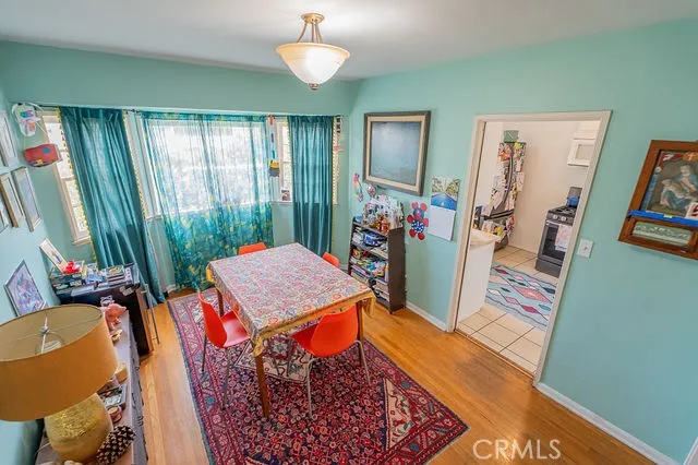 a dining room with a table and chairs
