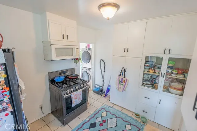 a kitchen with a refrigerator and a sink