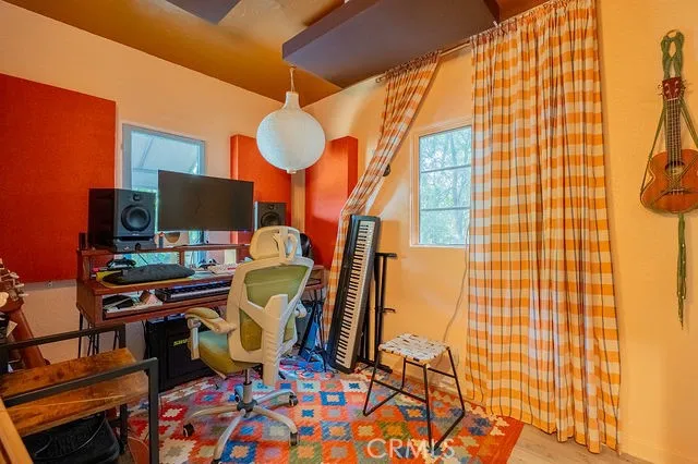 a bathroom with a toilet and shower curtain