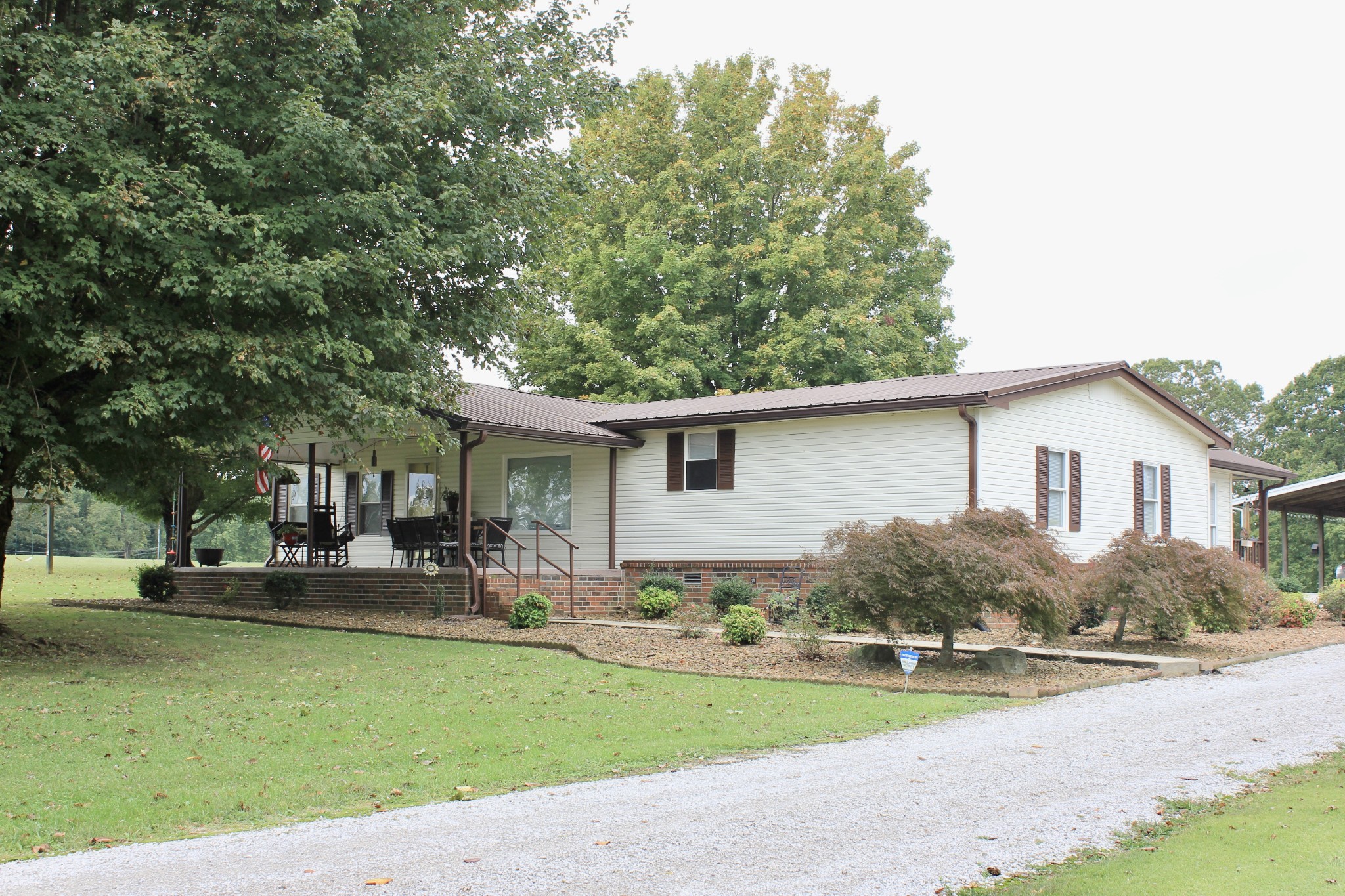 a view of a yard and front view of a house