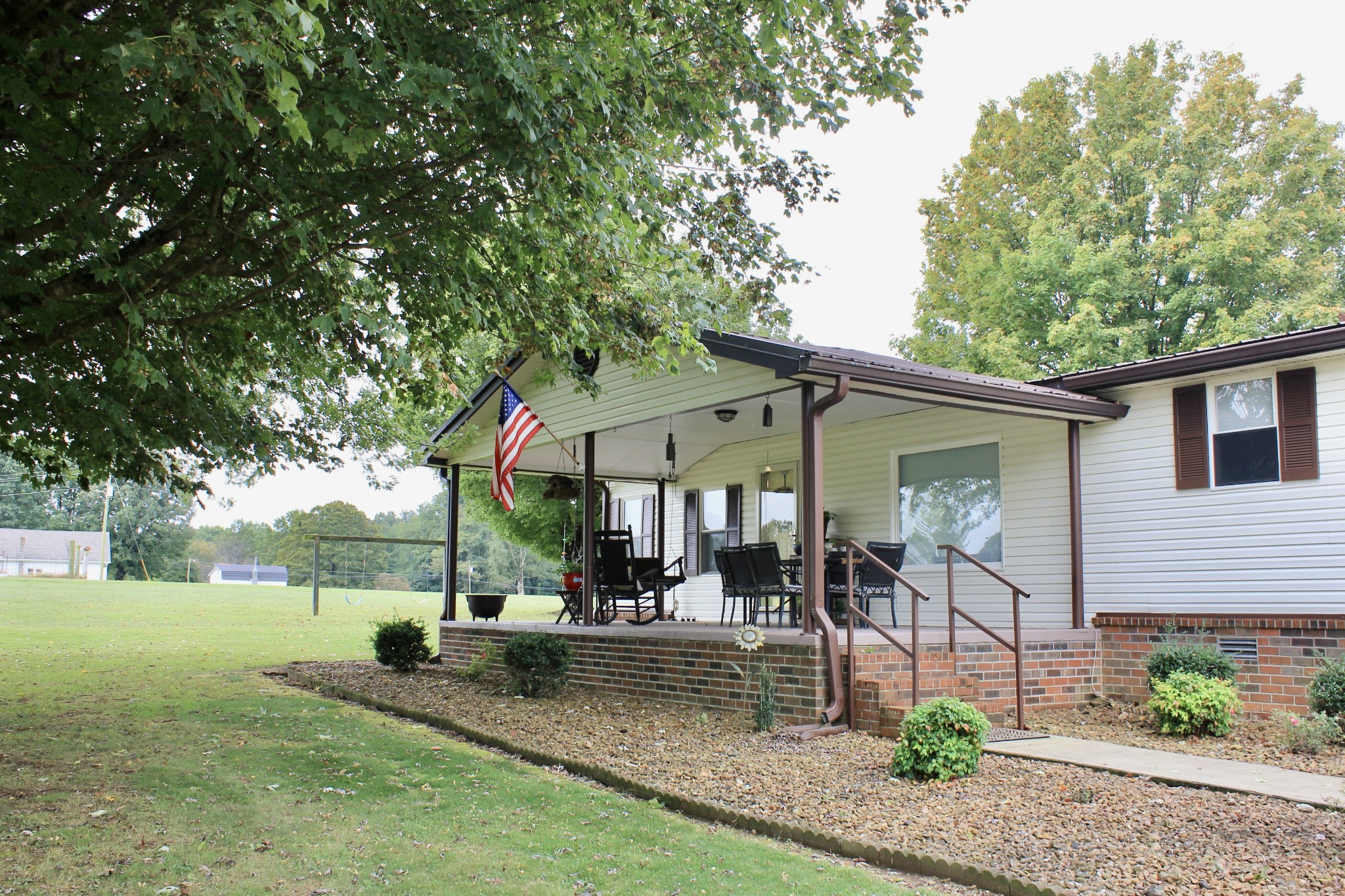 375 Nickajack Trail Monteagle, TN 37356 - Photo 4 of 34 a front view of a house with garden
