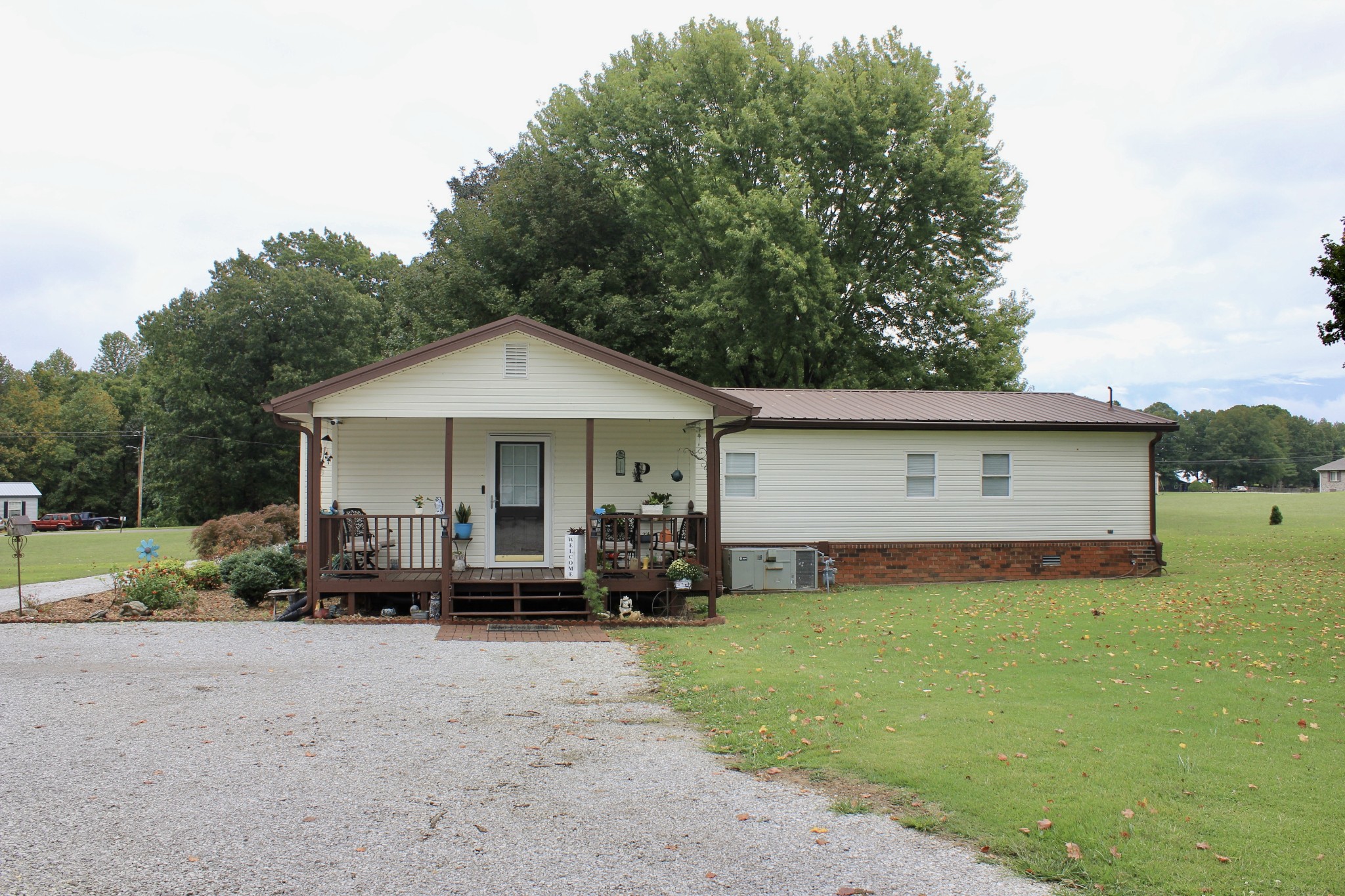375 Nickajack Trail Monteagle, TN 37356 - Photo 9 of 34 a front view of a house with a yard and trees