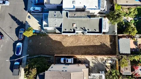 an aerial view of houses with outdoor space