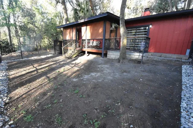 a view of a yard with a tree