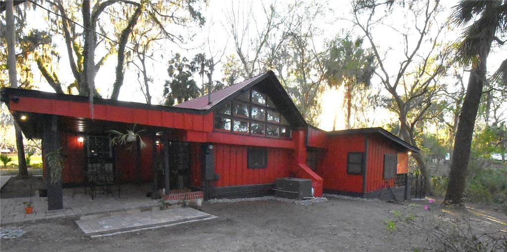 1302 Southeast Wacahoota Road Micanopy, FL 32667 - Photo 32 of 67 a view of a house with a yard and tree s