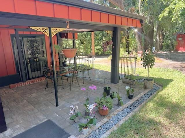 1302 Southeast Wacahoota Road Micanopy, FL 32667 - Photo 33 of 67 a front view of a house with a porch