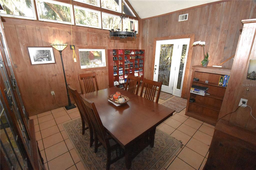 1302 Southeast Wacahoota Road Micanopy, FL 32667 - Photo 38 of 67 a view of a dining room with furniture