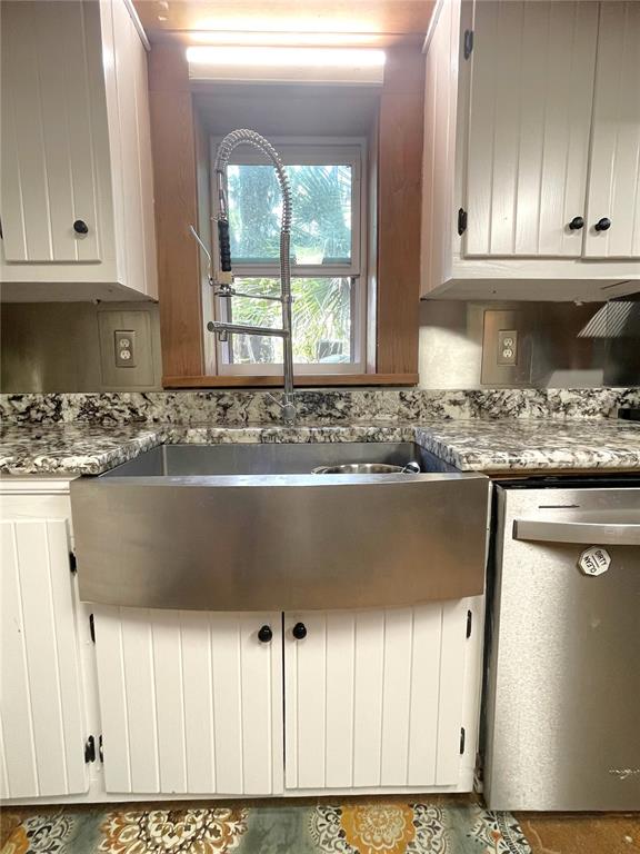 1302 Southeast Wacahoota Road Micanopy, FL 32667 - Photo 42 of 67 a view of kitchen with granite countertop white cabinets and window