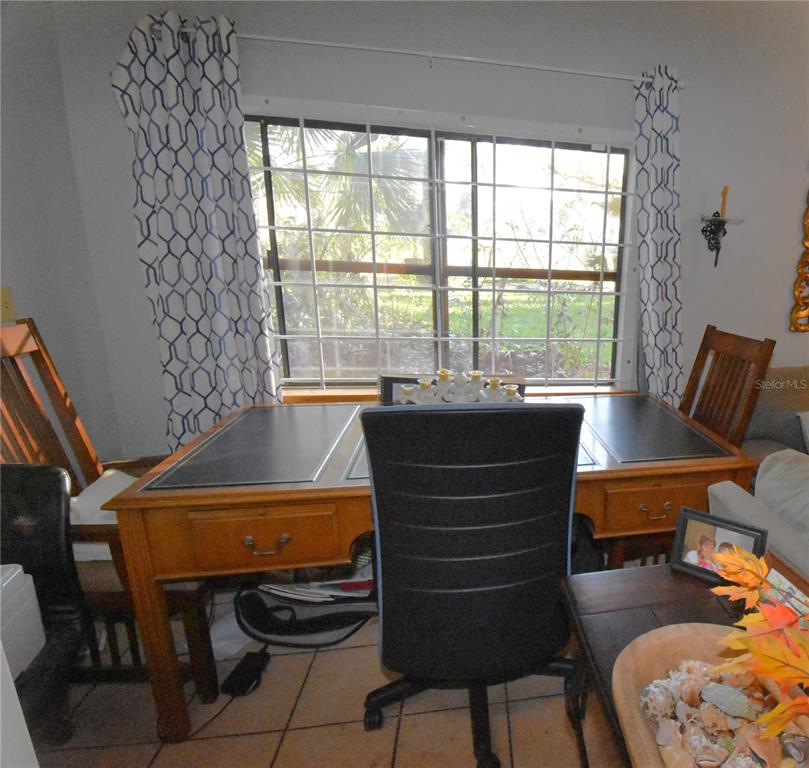 1302 Southeast Wacahoota Road Micanopy, FL 32667 - Photo 45 of 67 a room with furniture and a window