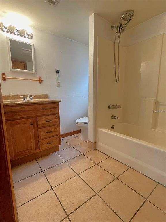 1302 Southeast Wacahoota Road Micanopy, FL 32667 - Photo 52 of 67 a bathroom with a sink a toilet and shower