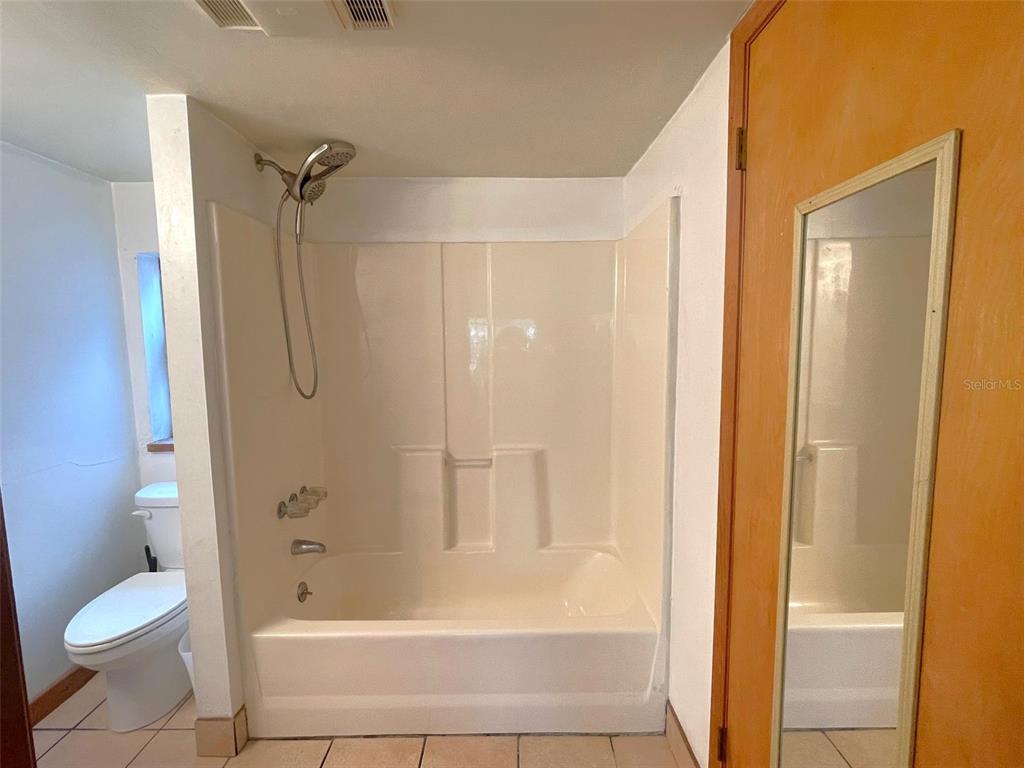 1302 Southeast Wacahoota Road Micanopy, FL 32667 - Photo 53 of 67 a bathroom with a shower and a toilet