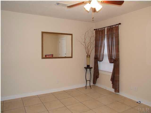 9 Milton Road Pensacola, FL 32507 - Photo 3 of 12 Living room with ceramic tile.