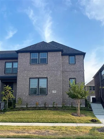 a view of house with yard